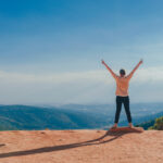person-in-beige-top-on-mountain-cliff-1134188